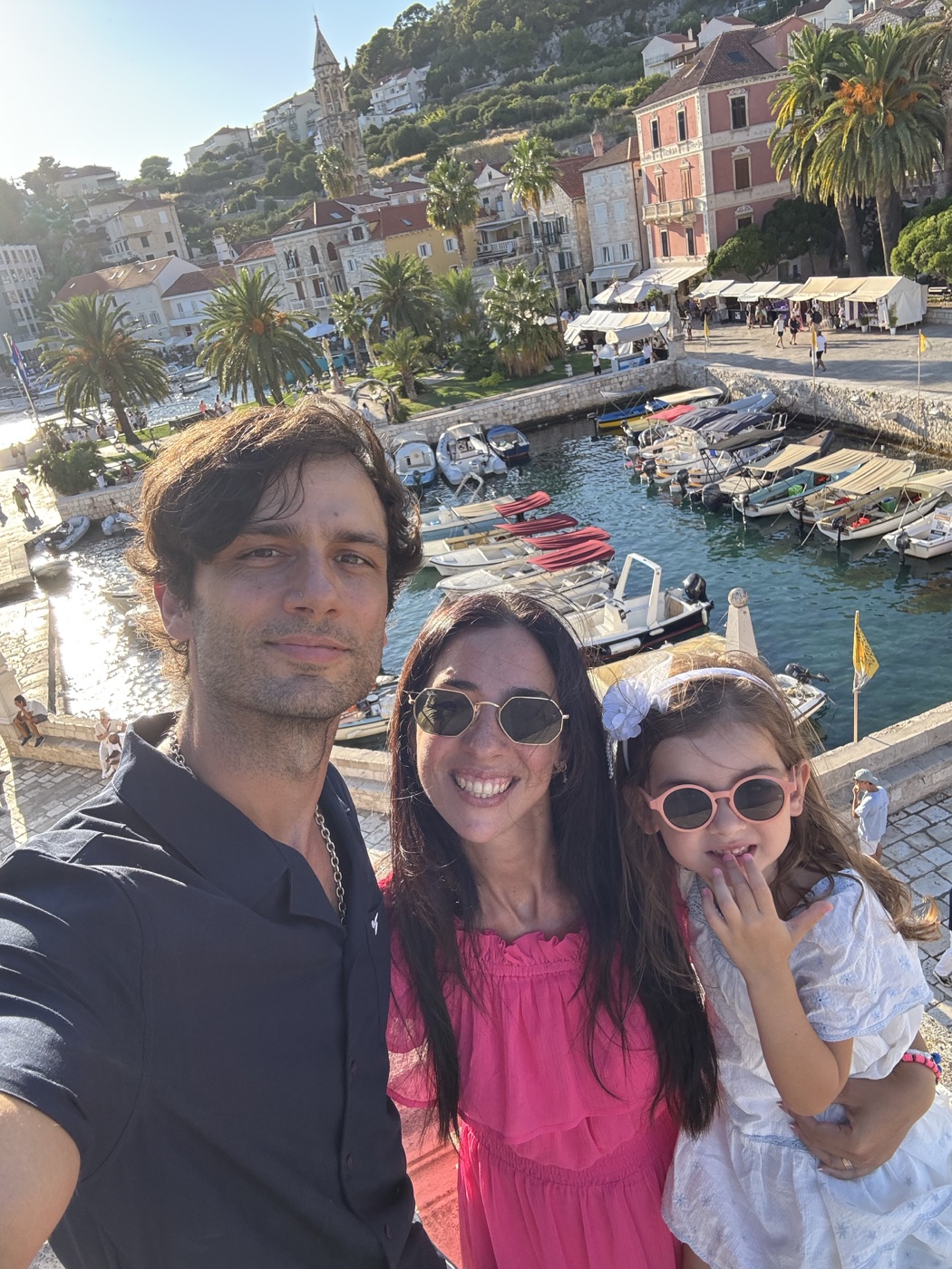 Matea and Vanja with their family by the sea